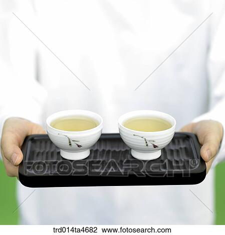 Two tea cups on teatray, art of tea making View Large Photo Image Stock Image - Two tea cups on teatray, art of tea making. Fotosearch
