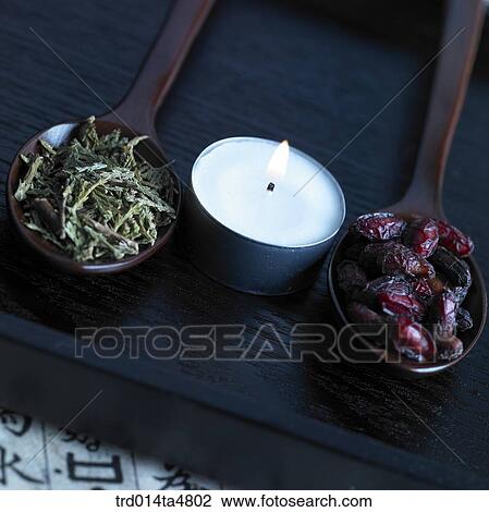 Chinese medicine on spoons and candles View Large Photo Image Stock Image - Chinese medicine on spoons and candles. Fotosearch