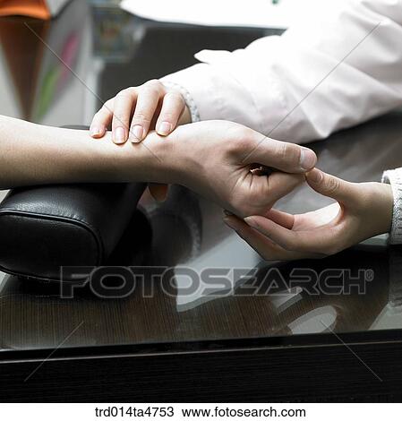 Chinese medicine oriental medicine/ Doctor examines patient View Large Photo Image Stock Image - Chinese medicine oriental medicine/ Doctor examines patient. Fotosearch