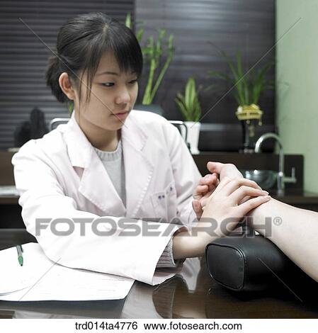 Chinese medicine oriental medicine/ Examining pulse of doctor View Large Photo Image Stock Photograph - Chinese medicine oriental medicine/ Examining pulse of doctor. Fotosearch