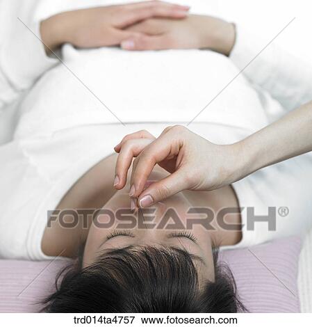 Chinese medicine oriental medicine/hand applying accupuntue on patient's face View Large Photo Image Stock Photo - Chinese medicine oriental medicine/hand applying accupuntue on patient's face. Fotosearch