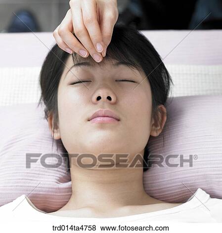 Chinese medicine oriental medicine/hand applying accupuntue on patient's face View Large Photo Image Stock Photo - Chinese medicine oriental medicine/hand applying accupuntue on patient's face. Fotosearch