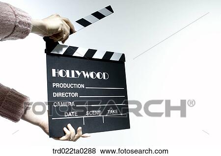 Image/a hand with a clapperboard View Large Photo Image Stock Photo - Image/a hand with a clapperboard. Fotosearch