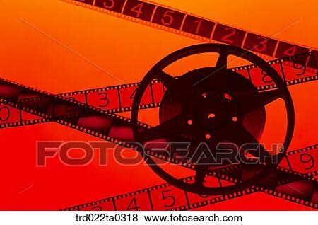 Stock Photo - Image/a piece of movie film and a reel and film. Fotosearch