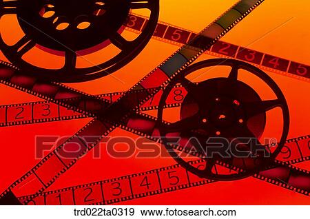 Stock Photo - Image/a piece of movie film and a reel and film. Fotosearch