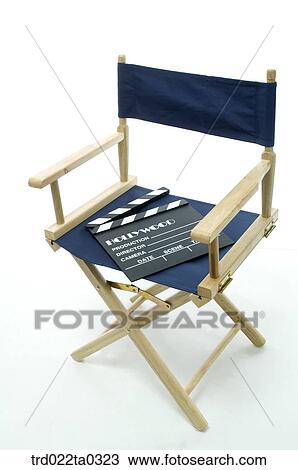 Stock Image - Image/shooting equipment, a clapperboard and a chair. Fotosearch