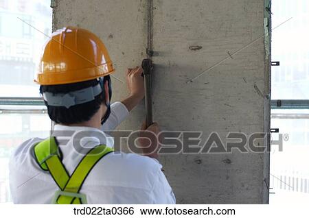 at a construction place, a hammering worker View Large Photo Image Stock Photograph - at a construction place, a hammering worker. Fotosearch