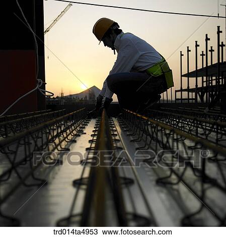 at a construction place, a worker's silhouette View Large Photo Image Stock Image - at a construction place, a worker's silhouette. Fotosearch