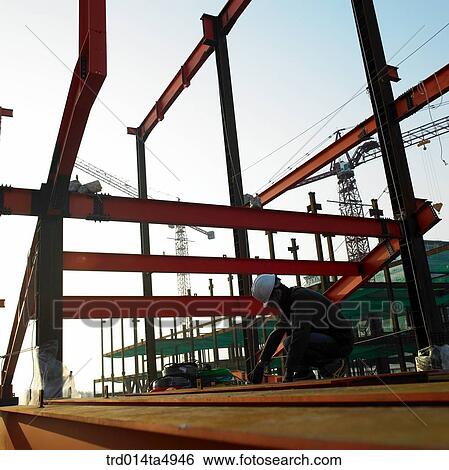 at a construction place, a worker's silhouette View Large Photo Image Stock Photograph - at a construction place, a worker's silhouette. Fotosearch