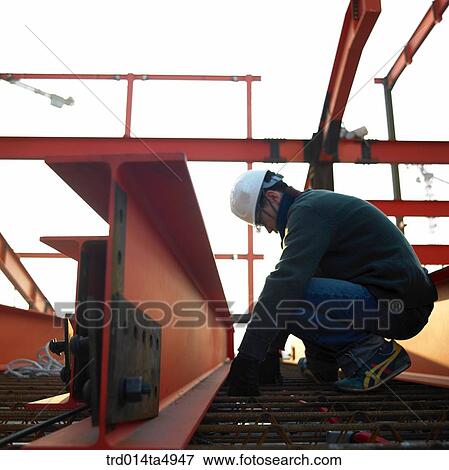 at a construction place, a working worker View Large Photo Image Stock Photo - at a construction place, a working worker. Fotosearch