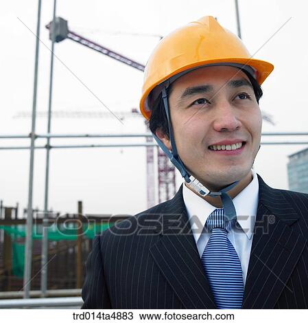 at a construction place, an architect looking at the workplace View Large Photo Image Stock Image - at a construction place, an architect looking at the workplace. Fotosearch