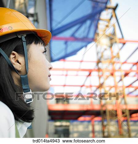 at a construction place, an architect looking around a workplace View Large Photo Image Stock Image - at a construction place, an architect looking around a workplace. Fotosearch