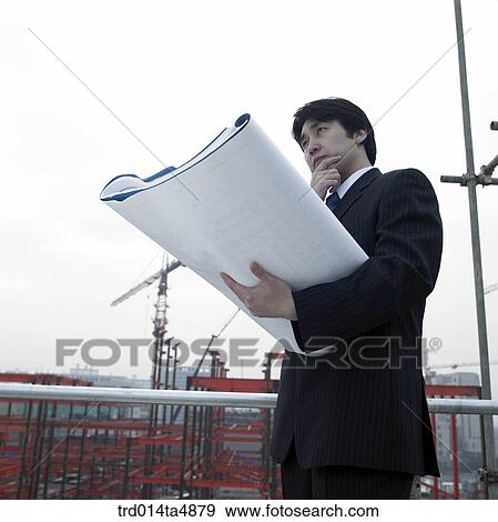 at a construction place, an architect thinking of a plan View Large Photo Image Stock Photo - at a construction place, an architect thinking of a plan. Fotosearch