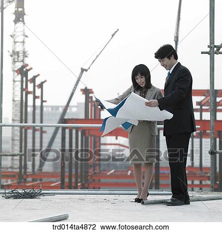 at a construction place, architects looking at a plan View Large Photo Image Stock Image - at a construction place, architects looking at a plan. Fotosearch