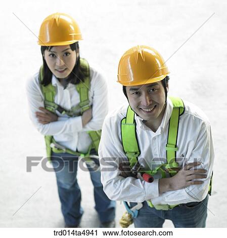 at a construction place, architects folding their arms View Large Photo Image Stock Image - at a construction place, architects folding their arms . Fotosearch