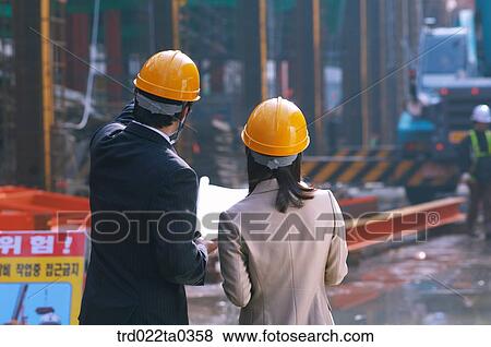 at a construction place, architects looking around a workplace View Large Photo Image Stock Photo - at a construction place, architects looking around a workplace. Fotosearch