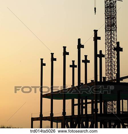 at a construction place, a construction equipment with the glow of the setting sun View Large Photo Image Stock Photograph - at a construction place, a construction equipment with the glow of the setting sun. Fotosearch