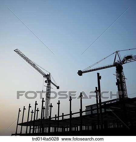 at a construction place, a crane and construction equipments View Large Photo Image Stock Photo - at a construction place, a crane and construction equipments. Fotosearch