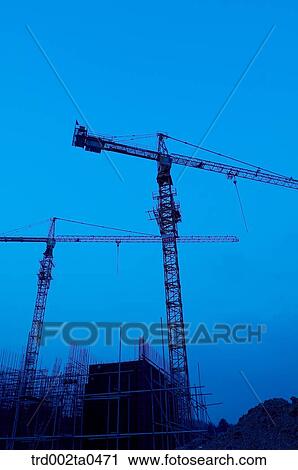 at a construction place, a crane in the evening View Large Photo Image Stock Image - at a construction place, a crane in the evening. Fotosearch