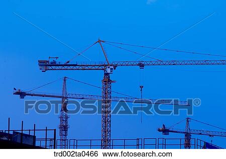at a construction place, a crane in the evening View Large Photo Image Stock Photograph - at a construction place, a crane in the evening. Fotosearch