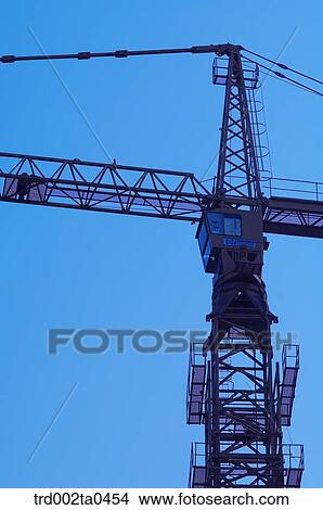 at a construction place, a crane View Large Photo Image Picture - at a construction place, a crane. Fotosearch