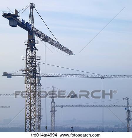 Picture - at a construction place, a crane. Fotosearch