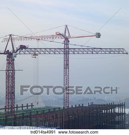 Stock Image - at a construction place, a crane. Fotosearch