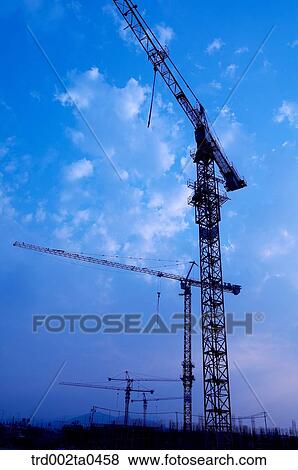 at a construction place, a crane View Large Photo Image Stock Photo - at a construction place, a crane. Fotosearch