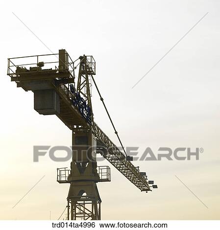 at a construction place, a crane View Large Photo Image Stock Photograph - at a construction place, a crane. Fotosearch