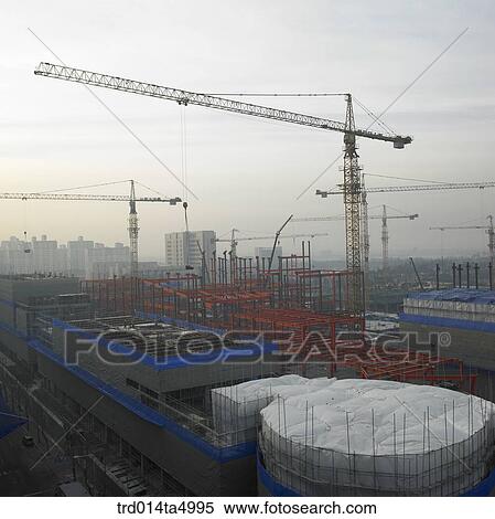 at a construction place, a crane View Large Photo Image Stock Photography - at a construction place, a crane. Fotosearch