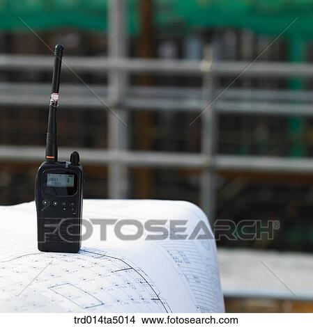 Picture - at a construction place, a plan and a radiotelegraph. Fotosearch