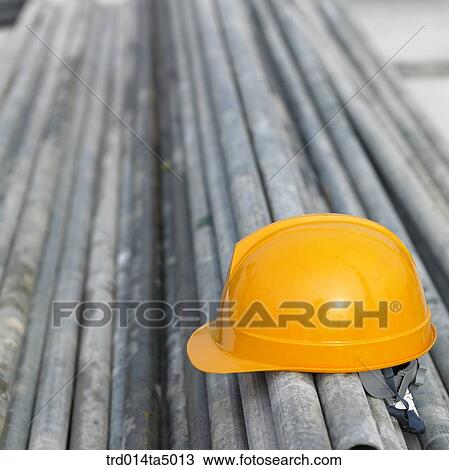 at a construction place, construction equipments and a safety hat View Large Photo Image Stock Image - at a construction place, construction equipments and a safety hat. Fotosearch