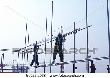 at a construction place, workers View Large Photo Image Picture - at a construction place, workers. Fotosearch