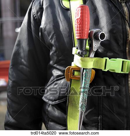 Stock Image - at a construction place, workers' uniform. Fotosearch