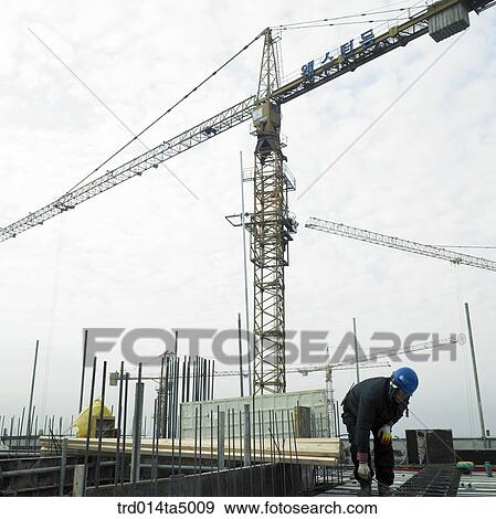at a construction place, workers View Large Photo Image Stock Photo - at a construction place, workers. Fotosearch