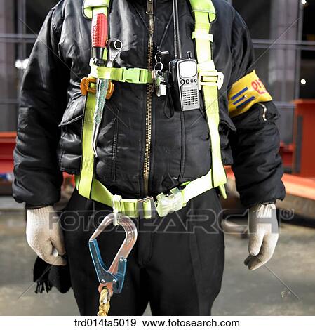 Stock Photo - at a construction place, workers' uniform. Fotosearch