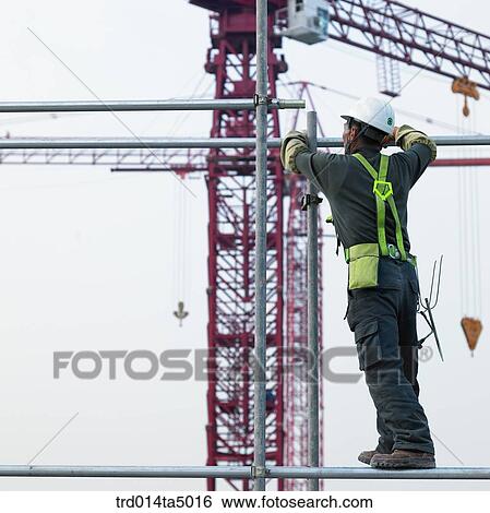 Stock Photograph - at a construction place, workers. Fotosearch