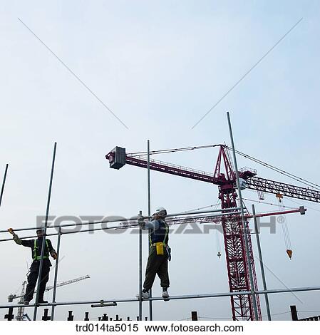 Stock Photography - at a construction place, workers. Fotosearch