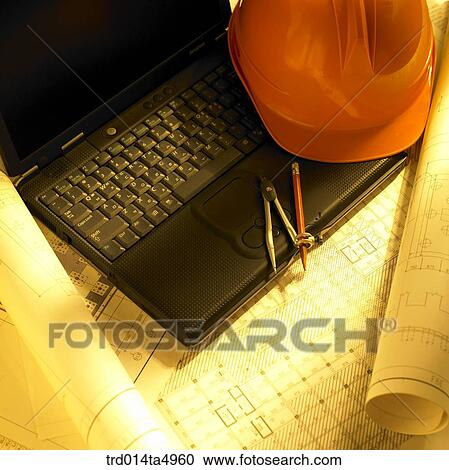 Stock Image - construction, a plan and a notebook on a desk. Fotosearch