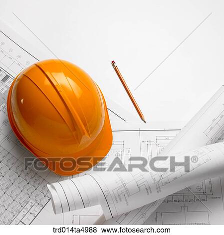 construction, a plan and a safety hat on a desk View Large Photo Image Stock Photo - construction, a plan and a safety hat on a desk. Fotosearch
