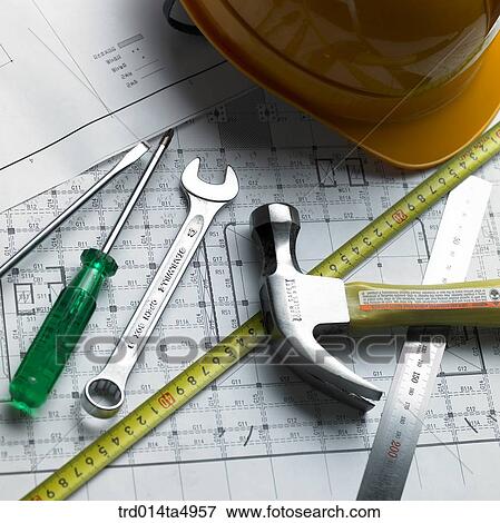 Stock Photo - construction, a plan and construction tools on a desk. Fotosearch