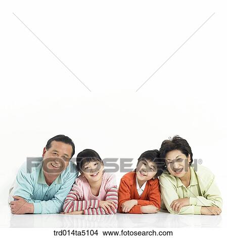 Family/ a family lying prone View Large Photo Image Picture - Family/ a family lying prone. Fotosearch