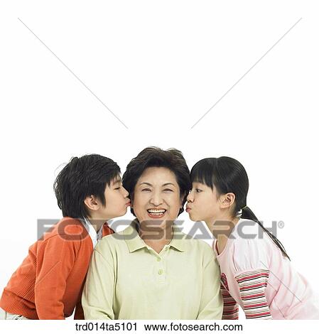 Family/ a granddaughter kissing her grandmother View Large Photo Image Stock Image - Family/ a granddaughter kissing her grandmother. Fotosearch