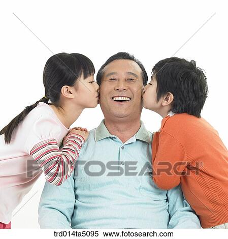 Family/ a granddaughter kissing her grandfather View Large Photo Image Stock Photography - Family/ a granddaughter kissing her grandfather. Fotosearch