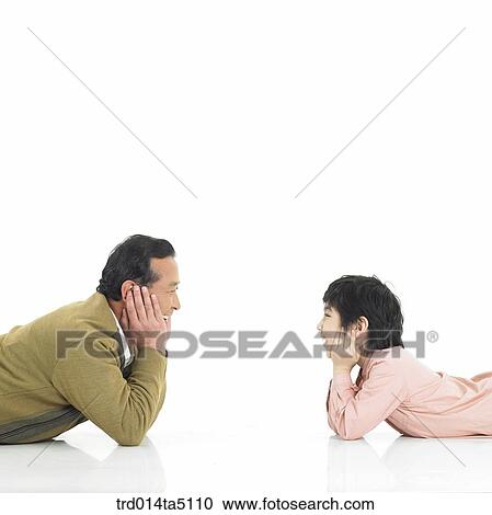 Family/ a grandfather and his grandson with their chins resting on the hand facing each other View Large Photo Image Stock Image - Family/ a grandfather and his grandson with their chins resting on the hand facing each other. Fotosearch