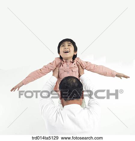 Family/ a grandfather hugging his grandson View Large Photo Image Stock Photo - Family/ a grandfather hugging his grandson. Fotosearch