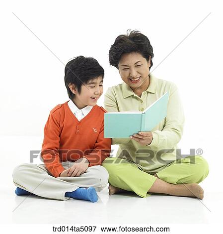 Family/ a grandmother giving a talk to her grandson View Large Photo Image Stock Photo - Family/ a grandmother giving a talk to her grandson . Fotosearch