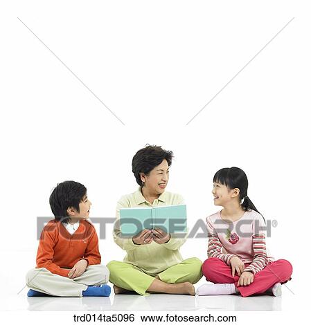 Family/ a grandmother giving a talk to her grandson and granddaughter View Large Photo Image Stock Photograph - Family/ a grandmother giving a talk to her grandson and granddaughter. Fotosearch