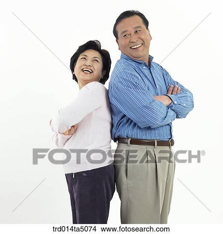 Family/ an friendly old couple with their arms folded leaning on each other View Large Photo Image Picture - Family/ an friendly old couple with their arms folded leaning on each other . Fotosearch