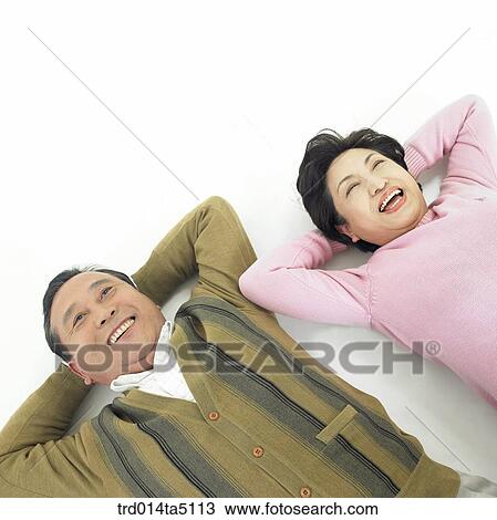 Family/ An old couple resting their heads on their elbows View Large Photo Image Stock Image - Family/ An old couple resting their heads on their elbows. Fotosearch